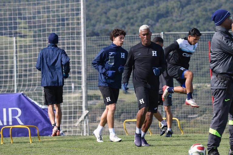 Honduras team warms up on field